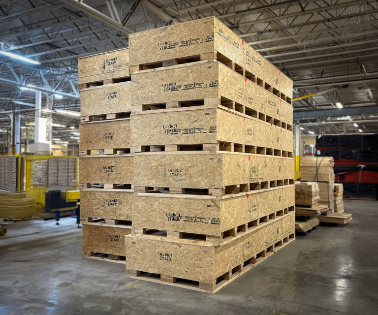 Stacked wooden shipping crates at Litco facility, ready for freight or export.