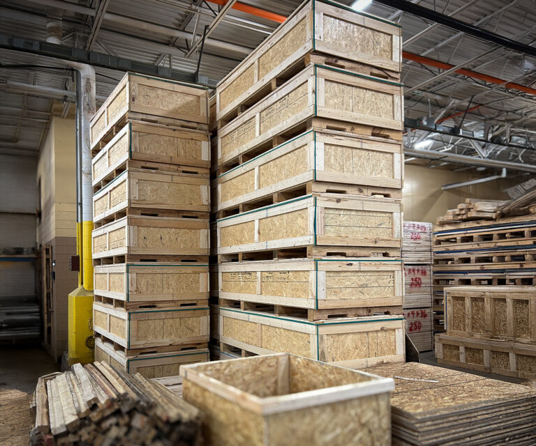 Heat-treated and ISPM-15 certified wooden crates stacked and ready for export shipment.