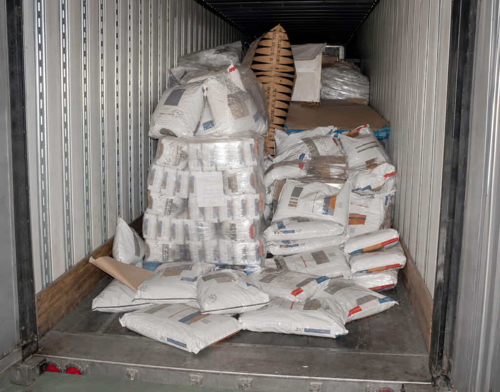 Chaotic transit damage in the back of a truck caused by improper use of airbags.