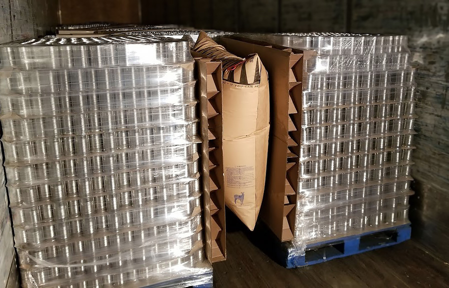 Bulkhead Panel reinforcing airbag installation to reduce product damage in shipping.